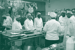 A picture of a culinary class conducted by Clara White Mission for formerly homeless men and women.