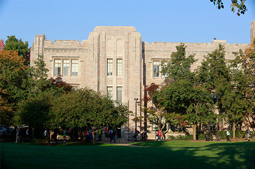 Photograph of the front façade of Jordan Hall, a three-story, stone, educational building.