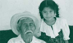 A picture of a child with her grandfather.