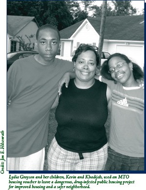 A picture of Lydia Grayson and her children, Kevin and Khadijah, who used an MTO housing voucher to leave a dangerous, drug-infested public housing project for improved housing and a safer neighborhood.