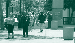 A picture of commuters near a metro station.