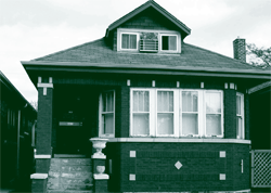 A picture of a Chicago home retrofitted with storm windows that reduced energy use and cost.