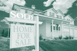 A picture of a single family house with a 'SOLD' sign in its frontyard.