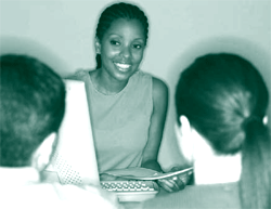 A picture of a HUD-approved counselor providing housing counseling to two homeowners.