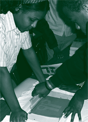 A picture of local youths designing t-shirts for an anti-violence campaign underwritten by an NSF grant.