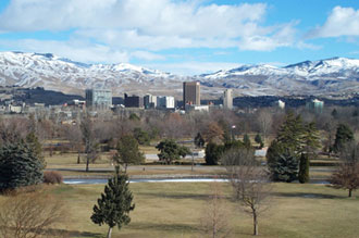Downtown Boise, Idaho with park in front and mountains in rear.
