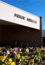 Building with a public library sign.