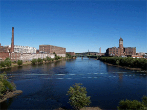 A view of mill buildings along the Merrimack River in Lawrence, Massachusetts.
