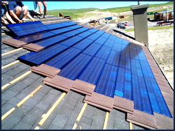 A picture showing the installation of photovoltaic roof panels.<br>Image Courtesy: U.S. Department of Energy/National Renewable Energy Laboratory