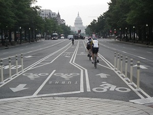 Cyclists ride in the dedicated Pennsylvania Avenue Cycletrack in Washington, DC